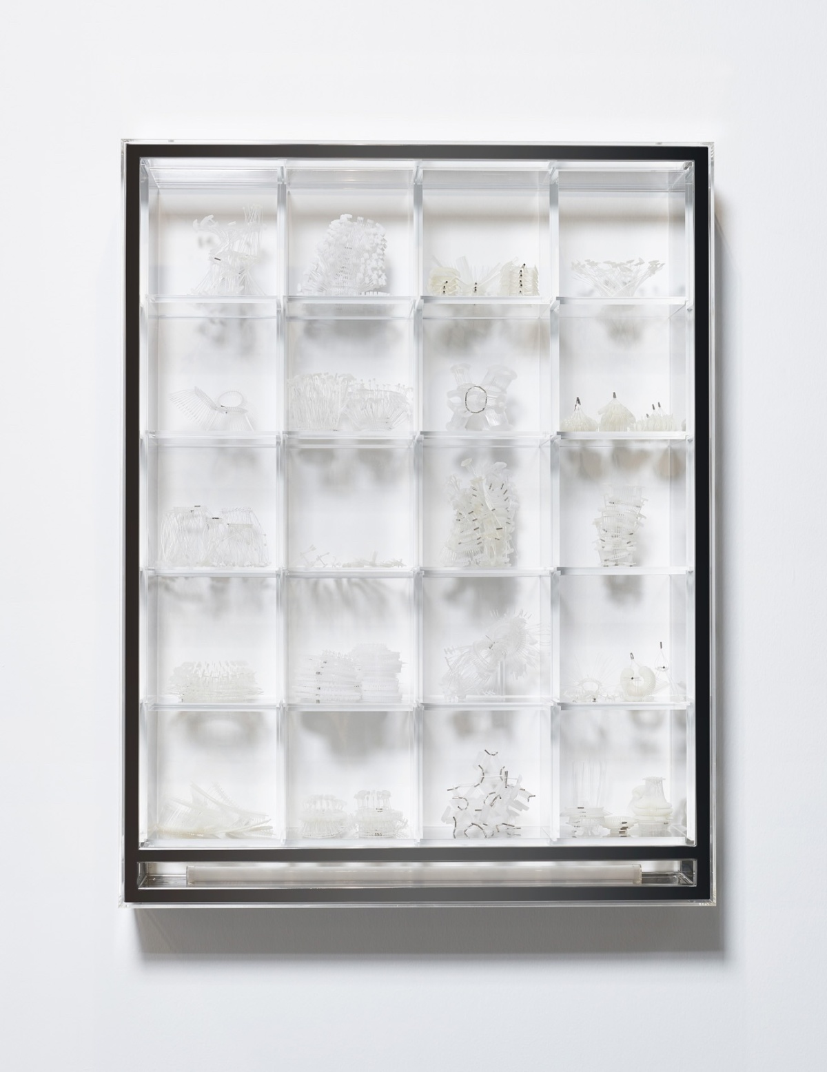 Grace TAN Stamp Collecting 2020 Wall mounted stainless steel and acrylic structure with LED light and objects made from polyamide and polypropylene tag pins and nickel plated brass tubes H94 x W73 x D16 cm. Photography by Jing 